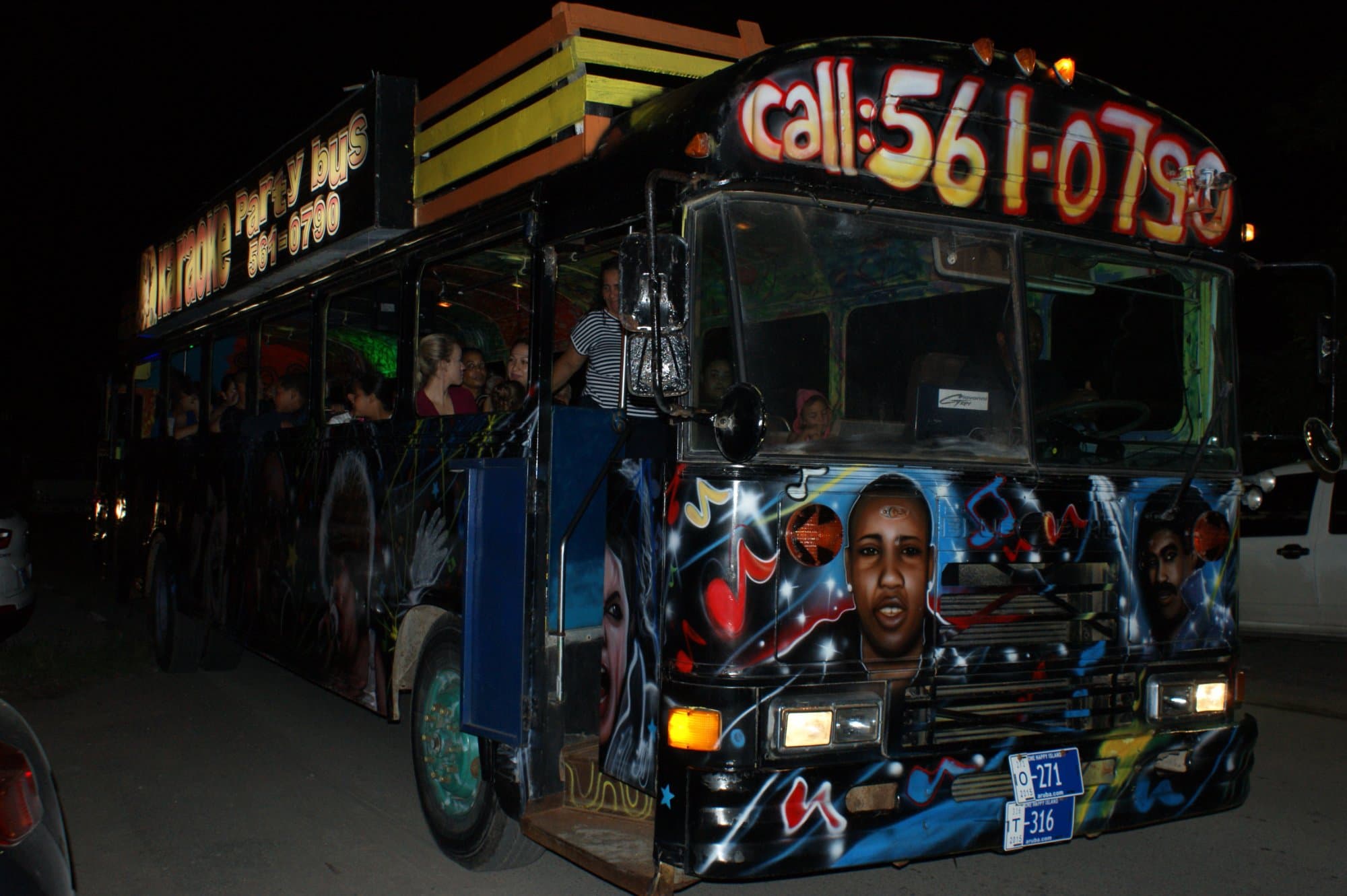 This is the bus, it is the only black bus in Aruba with singers on it painted.