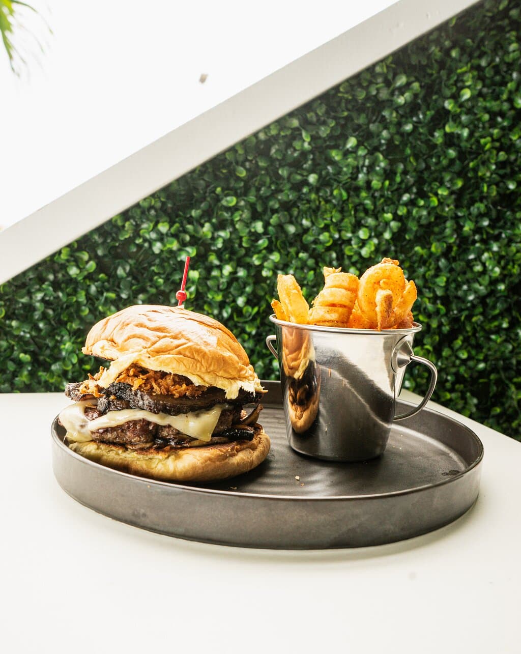 Classic Hamburger - House made burger, lettuce, tomato, onions, pickles, American cheese and bacon